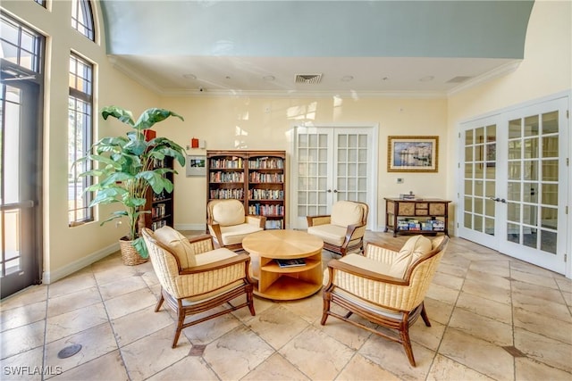 sitting room with french doors and ornamental molding