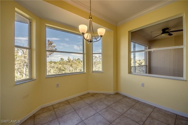 unfurnished dining area featuring crown molding, ceiling fan with notable chandelier, and light tile patterned floors