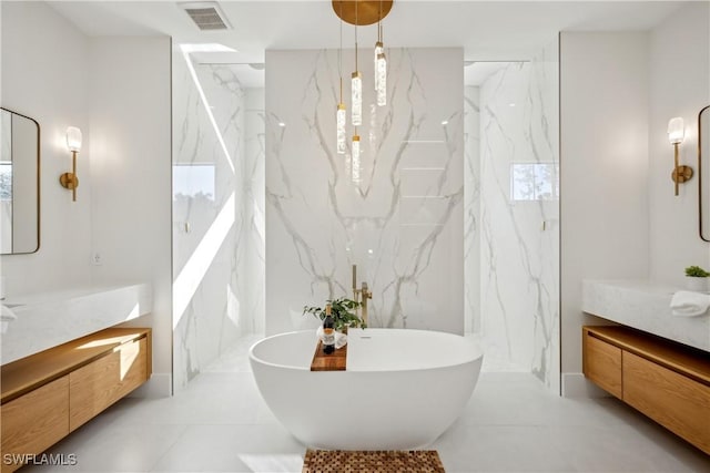 bathroom featuring vanity and a bathing tub