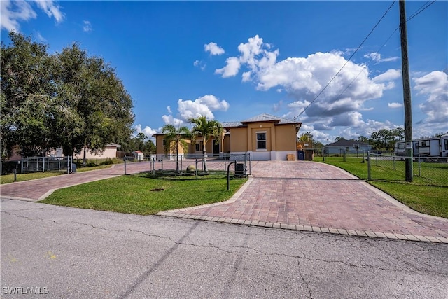 view of front of property with a front lawn