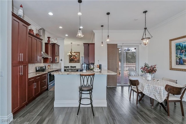 kitchen featuring a kitchen breakfast bar, hanging light fixtures, light stone countertops, an inviting chandelier, and stainless steel electric range