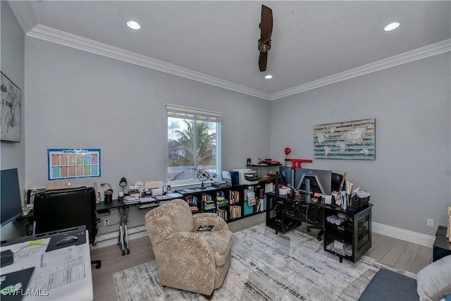 home office with crown molding and light hardwood / wood-style flooring