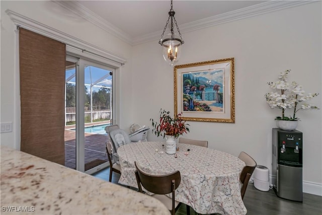 dining space featuring crown molding and dark hardwood / wood-style floors