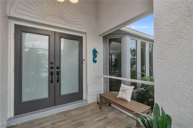 entrance to property featuring french doors