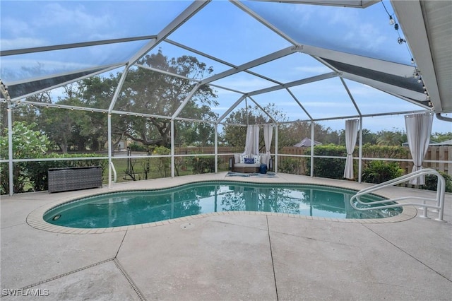 view of pool with a lanai and a patio area