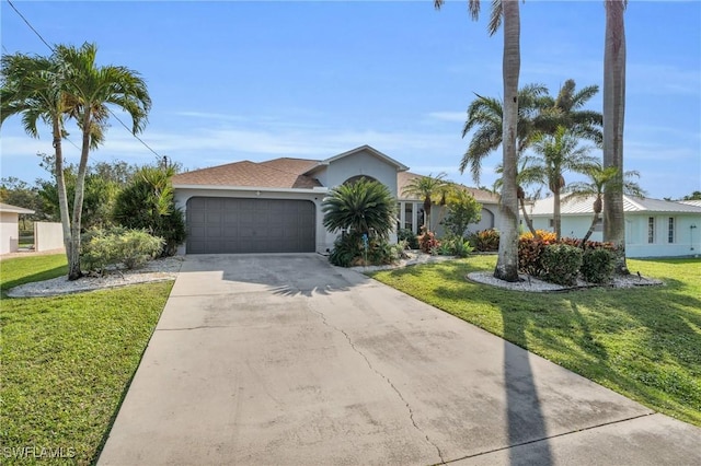 ranch-style home featuring a garage and a front yard