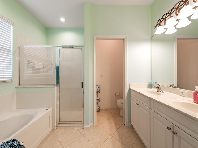 full bathroom with shower with separate bathtub, vanity, tile patterned floors, and toilet