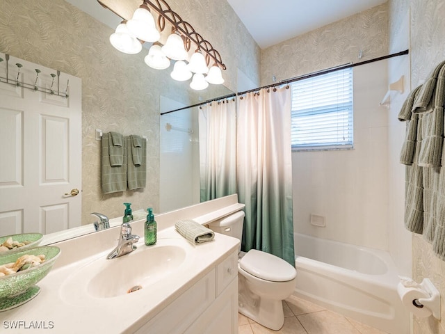 full bathroom featuring tile patterned flooring, vanity, toilet, and shower / bath combo with shower curtain