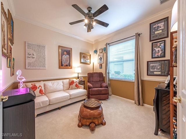 living room featuring crown molding, light colored carpet, and ceiling fan