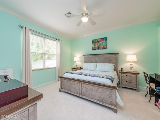 carpeted bedroom featuring crown molding and ceiling fan