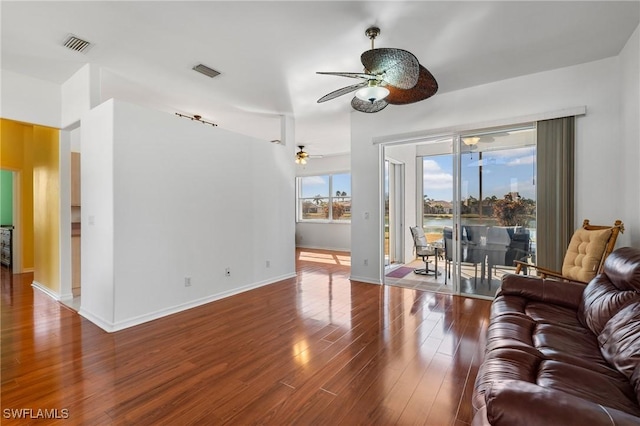 living room featuring hardwood / wood-style flooring and ceiling fan