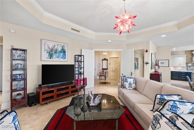 tiled living room featuring a raised ceiling, ornamental molding, and a chandelier