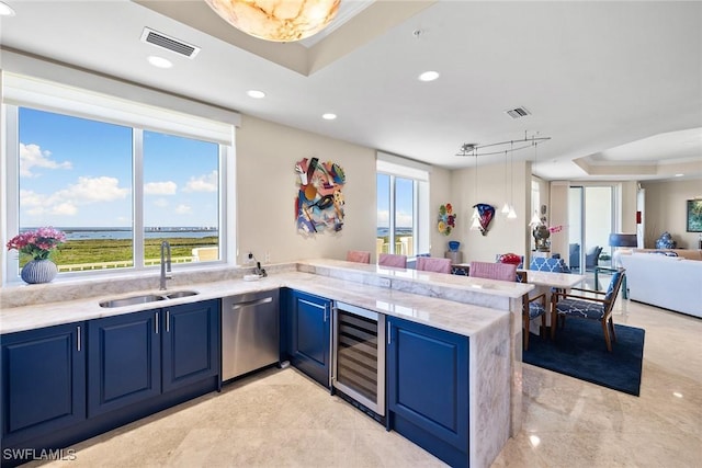 kitchen featuring sink, a tray ceiling, dishwasher, kitchen peninsula, and beverage cooler