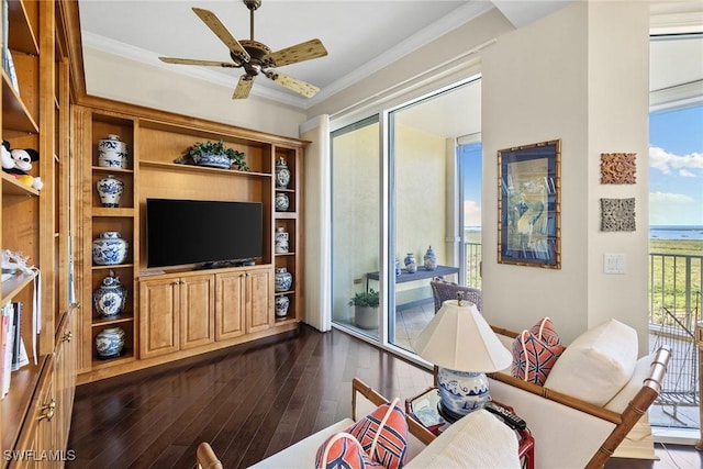 living room with dark hardwood / wood-style flooring, ornamental molding, and ceiling fan