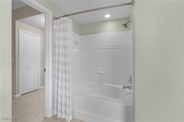 bathroom with tile patterned flooring and shower / bath combo with shower curtain