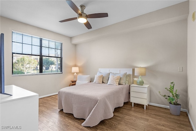 bedroom featuring ceiling fan and hardwood / wood-style floors