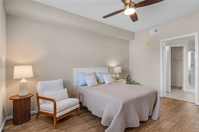 bedroom featuring hardwood / wood-style flooring and ceiling fan