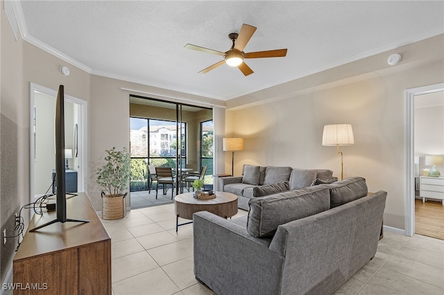 12936 Violino Ln Unit 108, Naples, FL 34105 - living area with crown molding, a ceiling fan, and light tile patterned floors