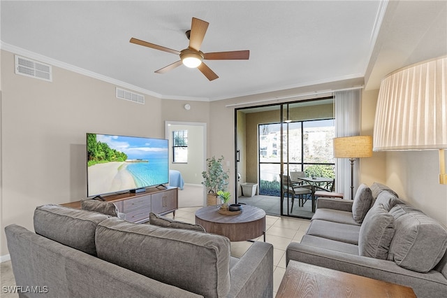 living room featuring ornamental molding, a healthy amount of sunlight, light tile patterned floors, and ceiling fan