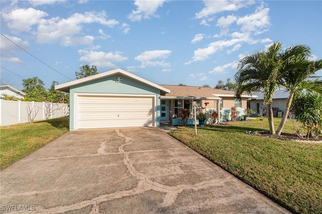 single story home featuring a garage and a front lawn