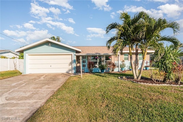 single story home featuring a garage and a front lawn