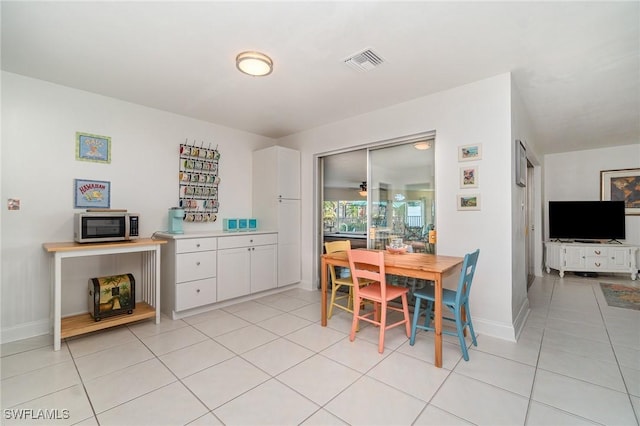 dining area featuring light tile patterned floors