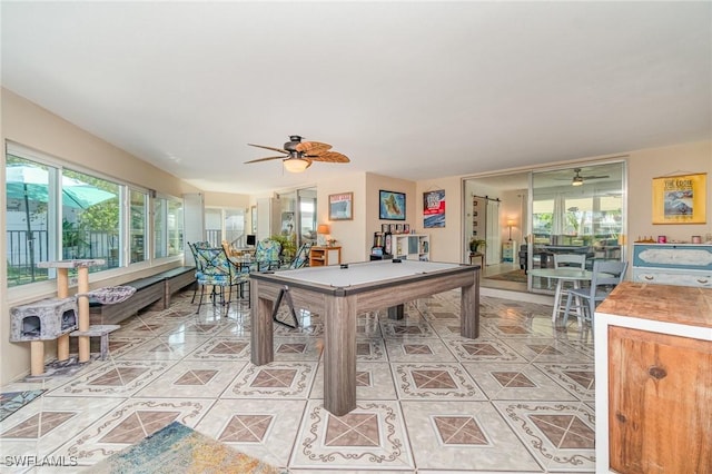 rec room with ceiling fan, plenty of natural light, light tile patterned floors, and pool table