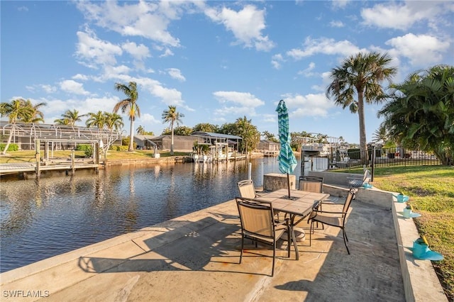 exterior space with a water view and a dock