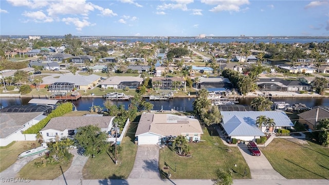 birds eye view of property with a water view