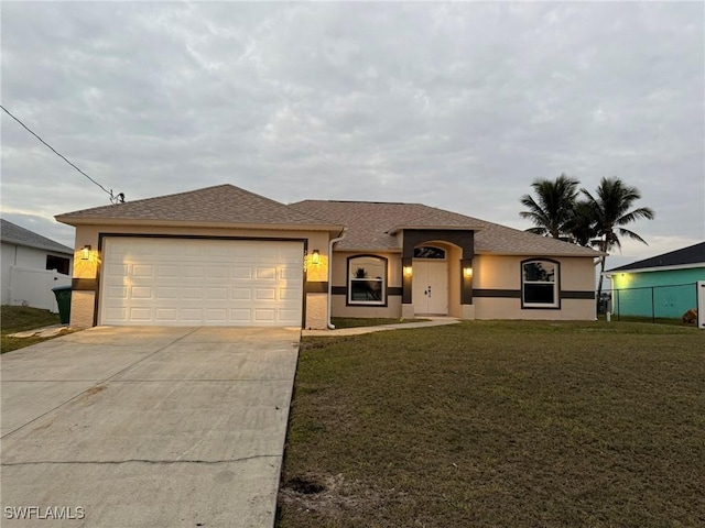 ranch-style house featuring a front yard, concrete driveway, an attached garage, and stucco siding