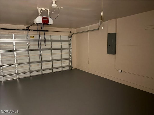 garage with a garage door opener and electric panel