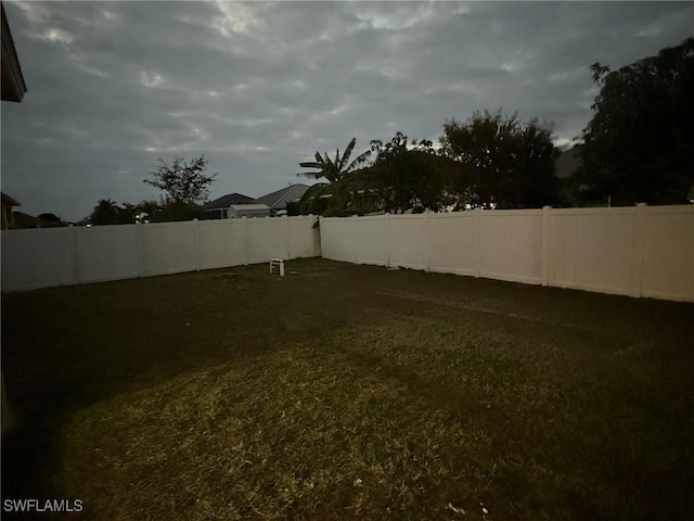 view of yard with a fenced backyard