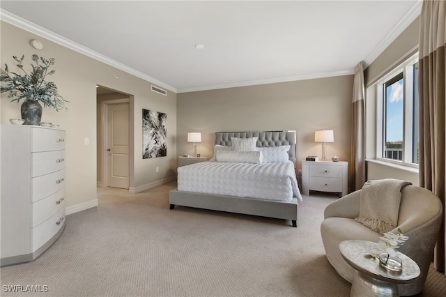 bedroom with crown molding and light colored carpet