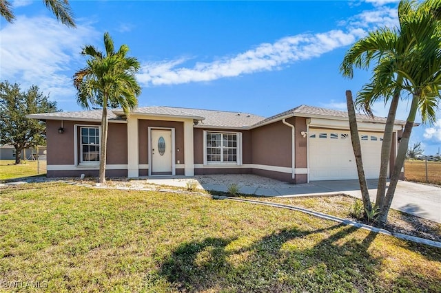 single story home featuring a front yard and a garage