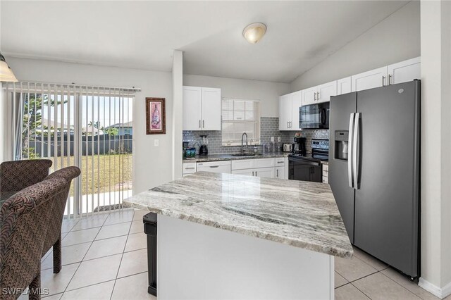 kitchen featuring a center island, white cabinets, sink, and black appliances