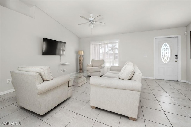 tiled living room with ceiling fan and lofted ceiling