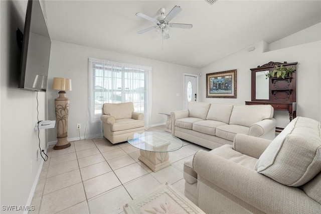 tiled living room with ceiling fan and vaulted ceiling