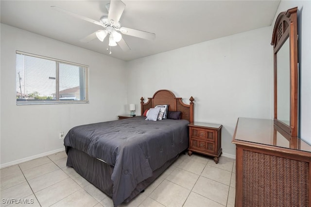 bedroom with ceiling fan and light tile patterned floors