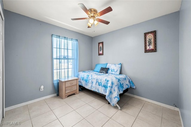 tiled bedroom with ceiling fan