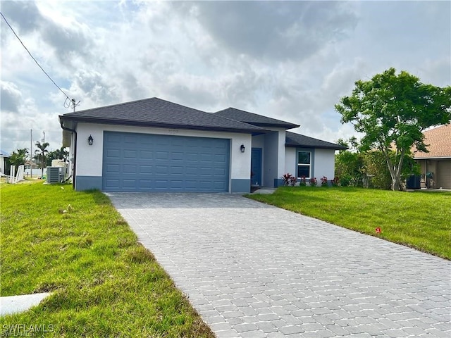 view of front of home featuring central AC, a garage, and a front yard