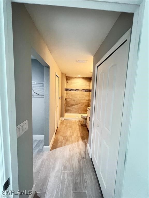 hallway with light wood-type flooring