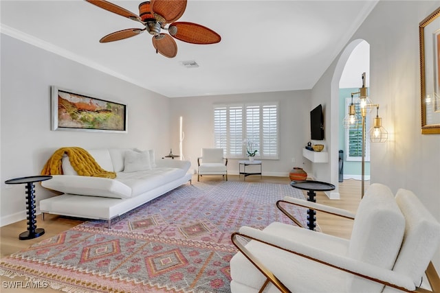 living room featuring hardwood / wood-style floors and ceiling fan