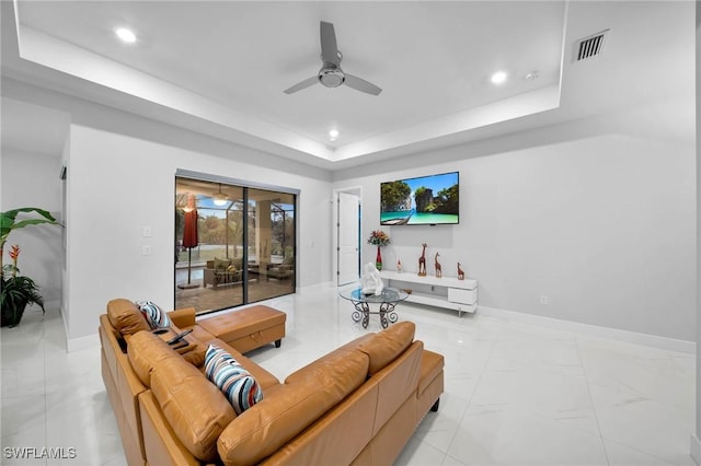2330 6th Ave NE, Naples, FL 34120 - living room featuring ceiling fan and a tray ceiling
