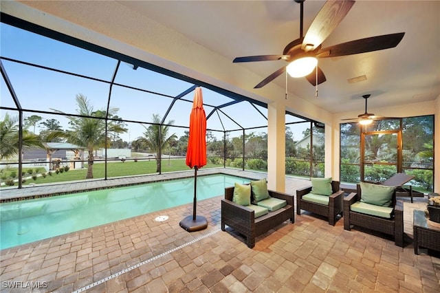 2330 6th Ave NE, Naples, FL 34120 - view of swimming pool featuring outdoor lounge area, a patio area, and glass enclosure