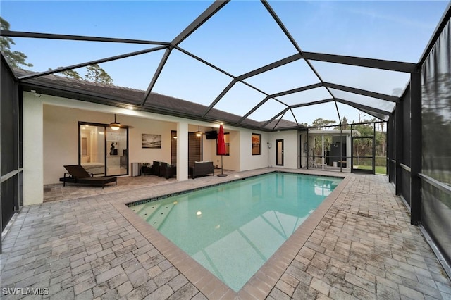 2330 6th Ave NE, Naples, FL 34120 - view of swimming pool with ceiling fan, a lanai, and a patio