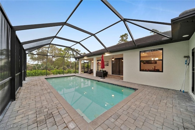 2330 6th Ave NE, Naples, FL 34120 - view of swimming pool with a patio and glass enclosure