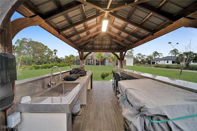 2330 6th Ave NE, Naples, FL 34120 - view of patio featuring a gazebo, a grill, and a wet bar