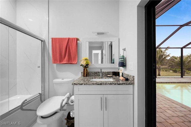 2330 6th Ave NE, Naples, FL 34120 - full bathroom with vanity, enclosed tub / shower combo, and toilet