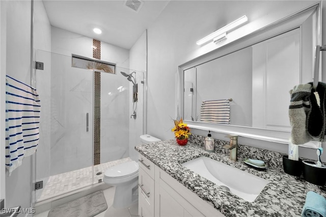2330 6th Ave NE, Naples, FL 34120 - bathroom with toilet, vanity, and walk in shower