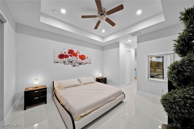 2330 6th Ave NE, Naples, FL 34120 - bedroom featuring a tray ceiling and ceiling fan